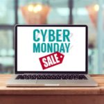 Cyber Monday sale tag displayed on laptop near store