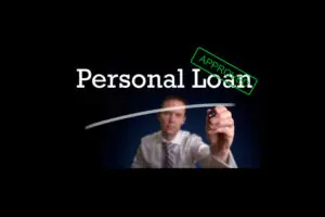 An underwriter approving a personal loan after bankruptcy, showing an Approved stamp on a digital application screen.