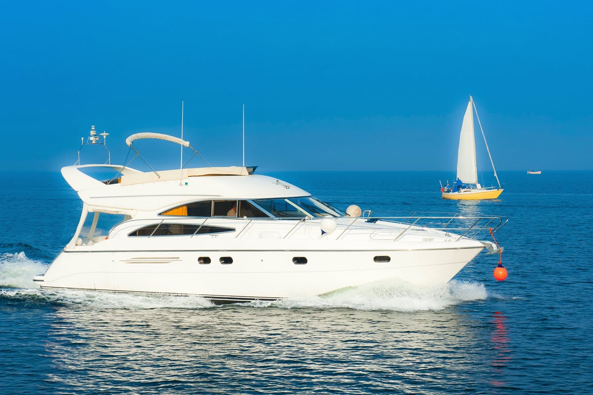 Large boat in ocean water during summertime.