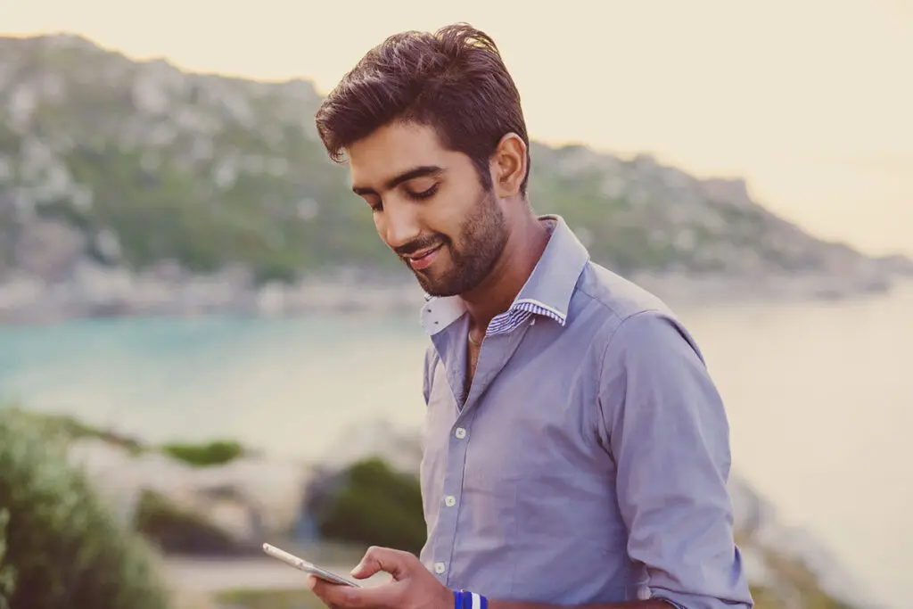 Comparing Top $35,000 Personal Loans A person using a smartphone to compare top $35,000 personal loan offers.