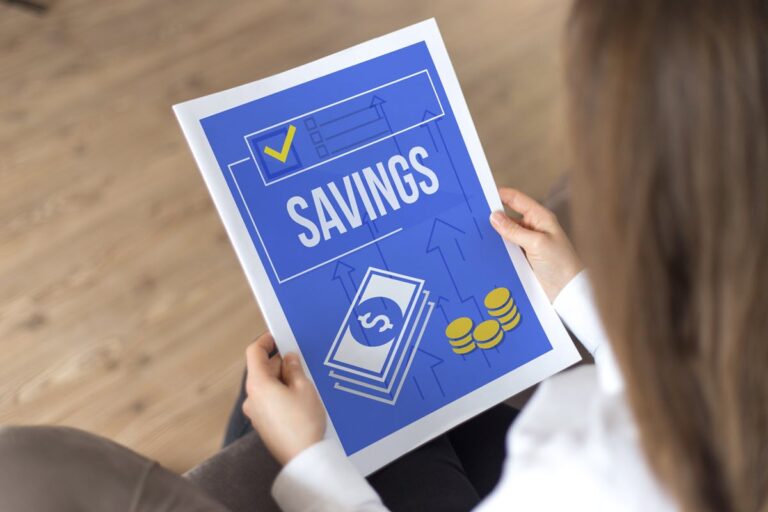 Person reading a document titled Savings to compare the best types of savings accounts.